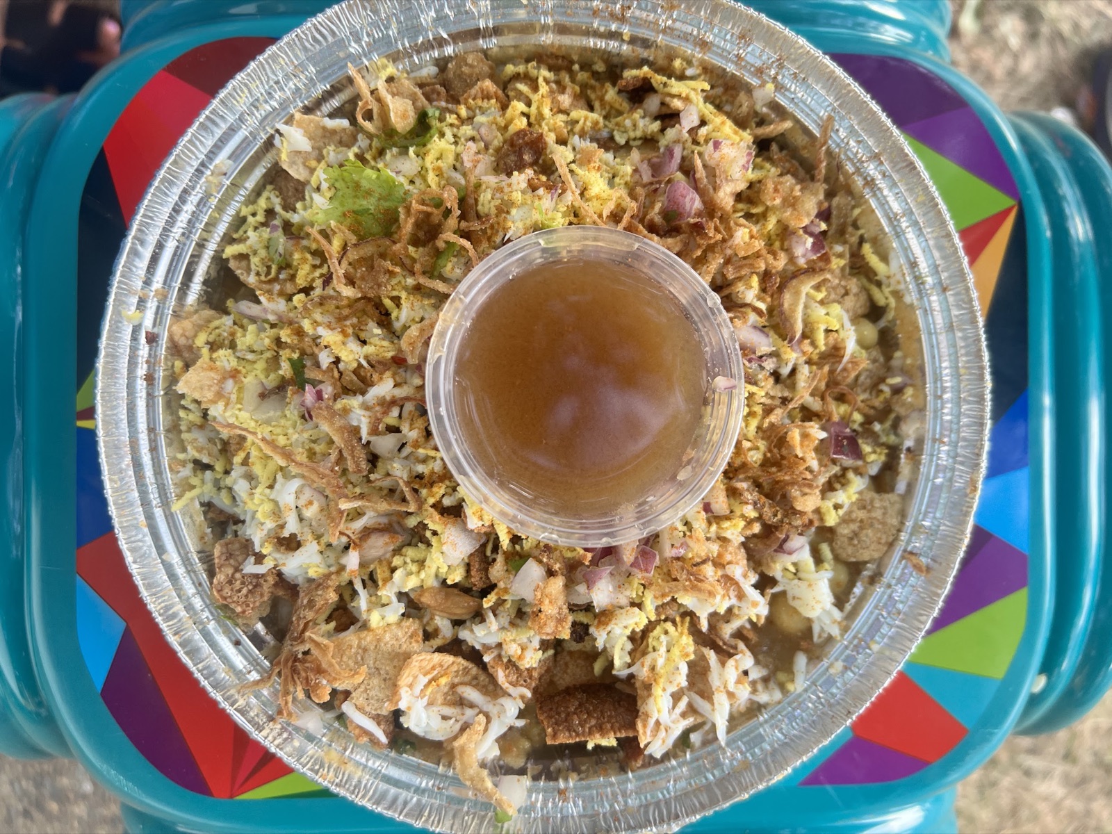 A bowl of chotpoti with tamarind water